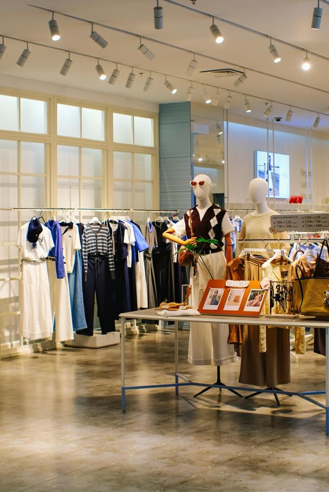 Retail clothing store with mannequins and apparel displays